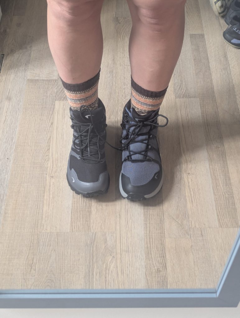 Inov-8 Roclite Pro comparison photo showing Front view of hiker wearing Inov-8 Roclite Max GORE-TEX (left) next to Inov-8 Roclite Pro Mid Wide Fit (right) for width comparison.
