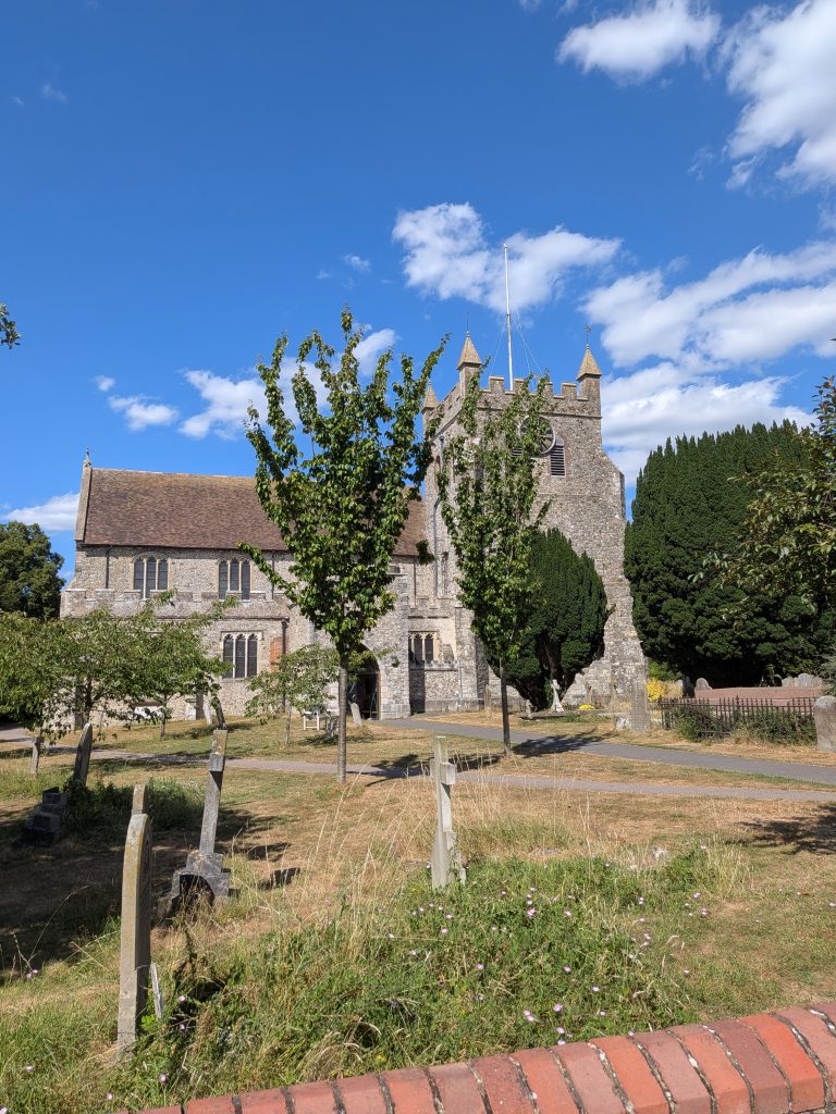 Historic flint church in Wye village at the start of the dog-friendly Wye Downs hiking trail.